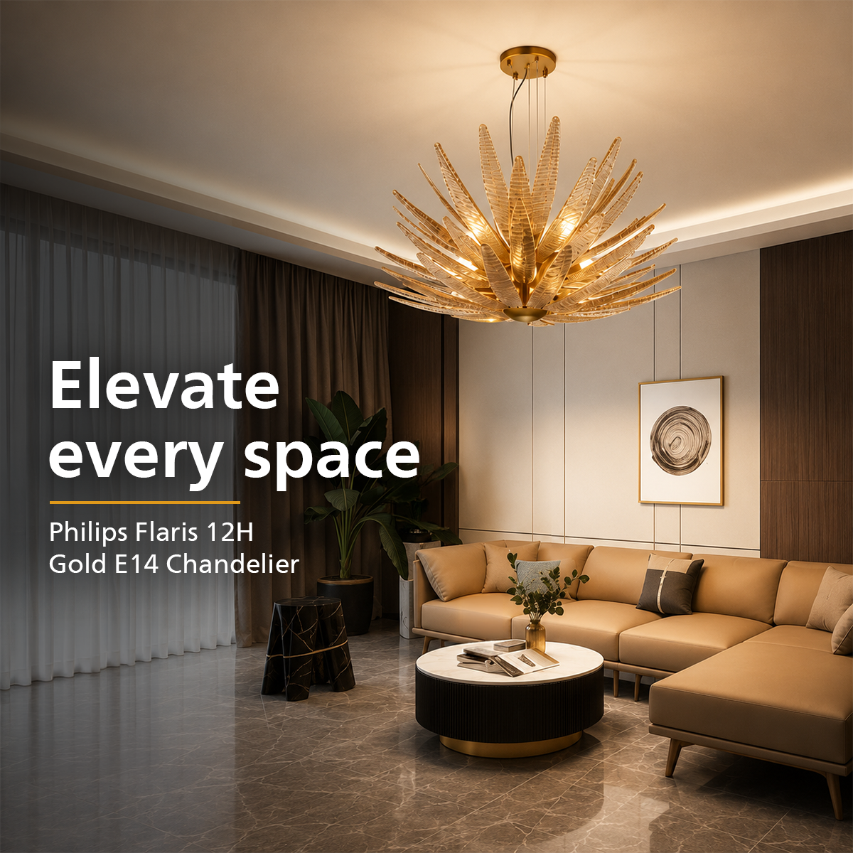 A modern living room featuring a large Philips Flaris 12H Gold E14 chandelier with a gold-toned sunburst design hanging from the ceiling. The room includes a beige sectional sofa, a round black and gold coffee table, and a large potted plant.